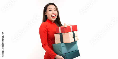 cute young girl with a gift on a white background in concept of happy lunar new year