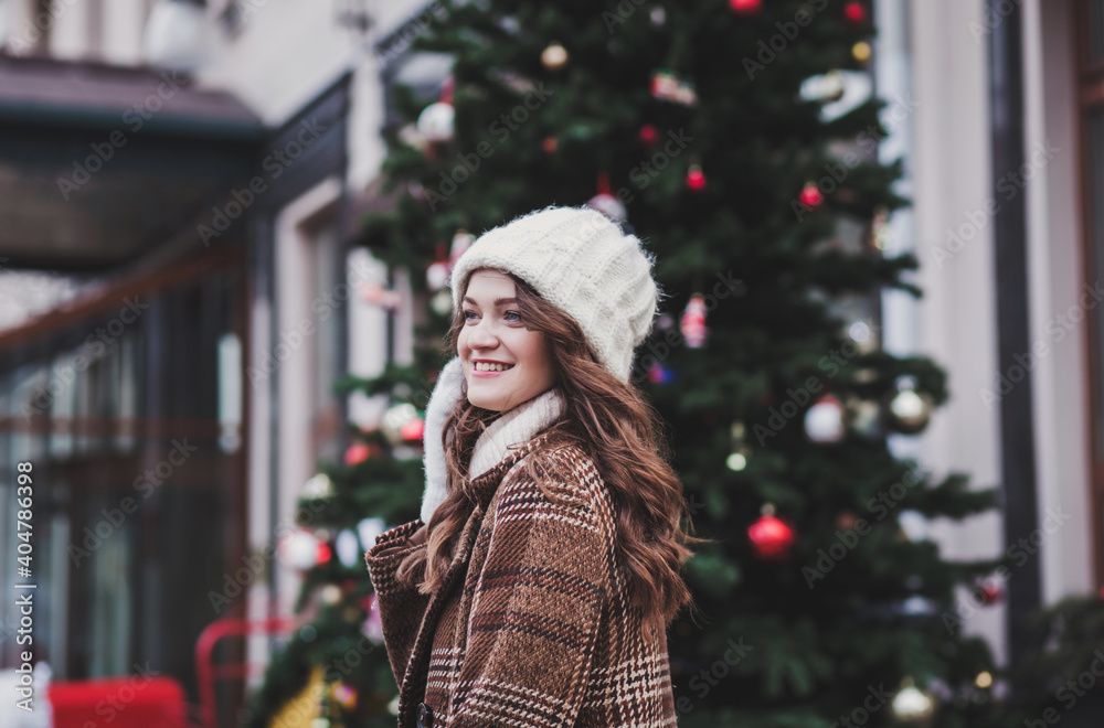 Winter smiling woman in hat and coat
