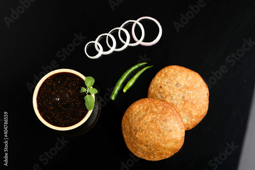 Kachori is a spicy snack from India also spelled as kachauri and kachodi. Served with tomato ketchup. Favorite Tea time snacks photo