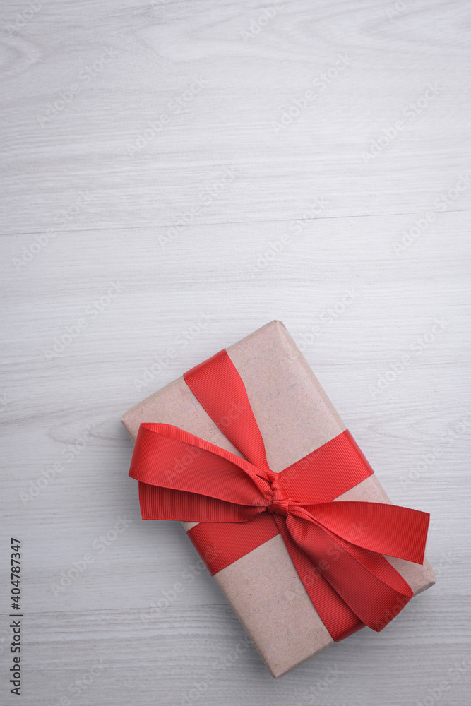 Background for Valentine's Day greeting card.Valentines day concept.Red gift ribbons, gifts, hearts on a wooden background. Top view Background for Valentine's Day greeting card.Valentines day concept.Red gift ribbons, gifts, hearts on a wooden background. Top view