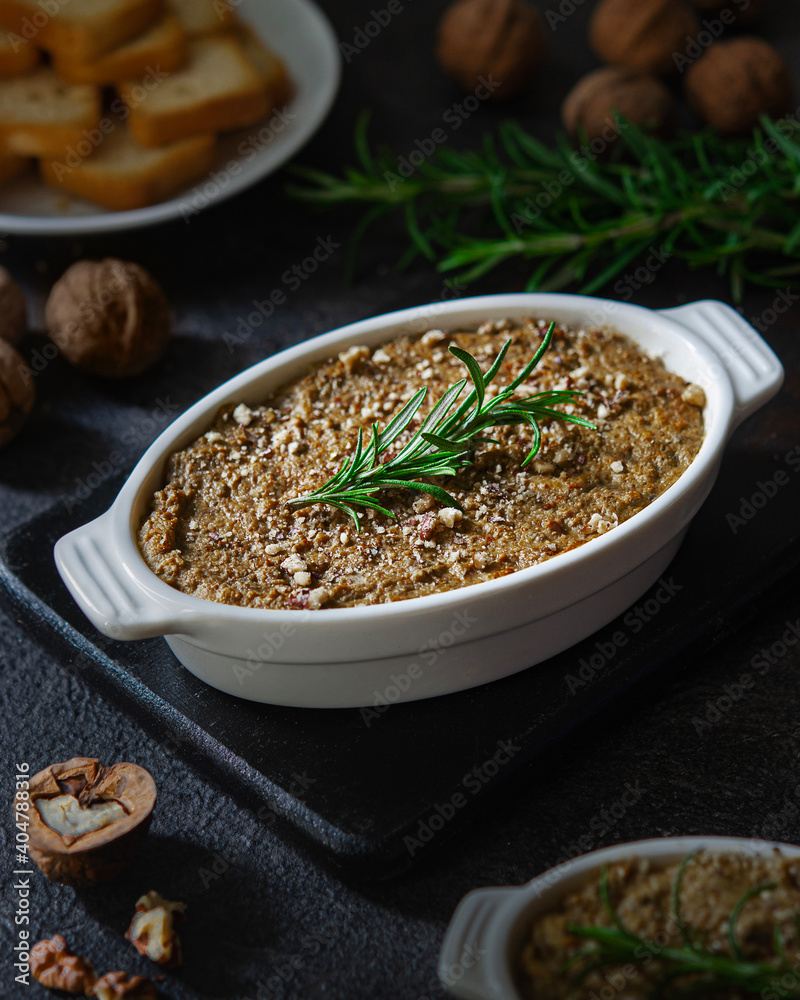 Delicious homemade liver pate with rosemary. Family dinner with the family, traditions. Delicious homemade liver pate with rosemary. Family dinner with the family, traditions.