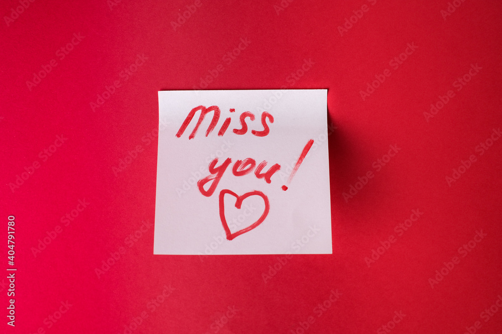 Sticker with love words written by pen, drawn heart and compliments for valentine s day at red background. Sticker with love words written by pen, drawn heart and compliments for valentine s day at red background.