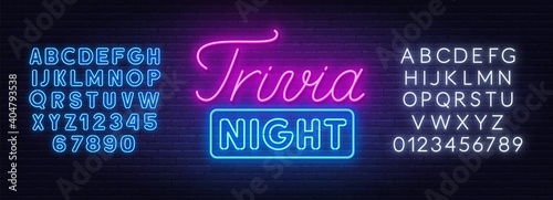 Trivia night neon sign on a brick wall. White and blue neon alphabets.