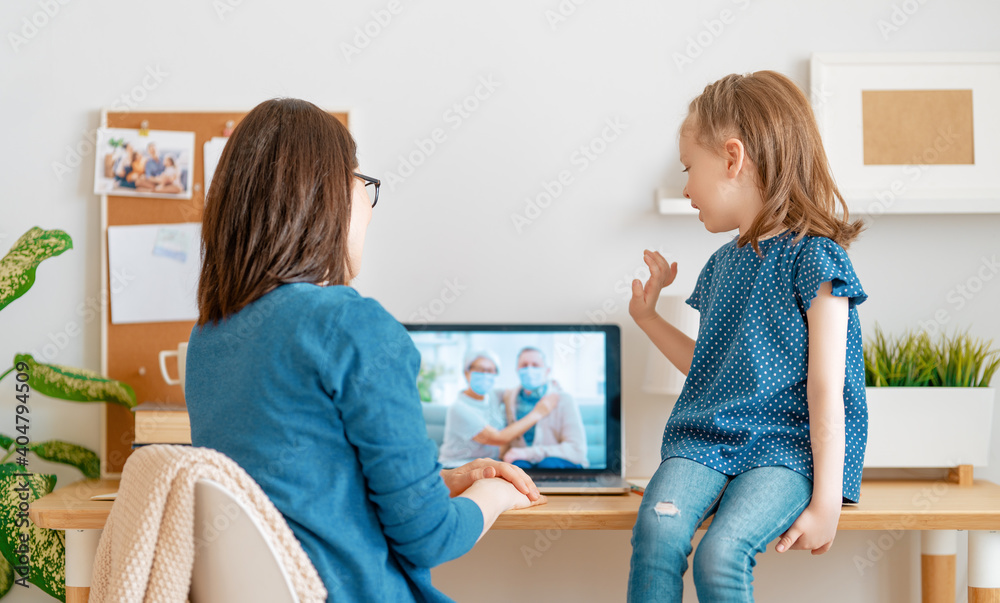 Woman and child talking with parents Woman and child talking with parents