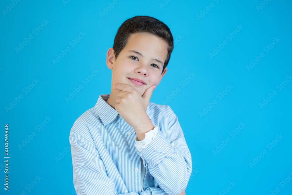 portrait of handsome boy smiling over blue background. portrait of handsome boy smiling over blue background.