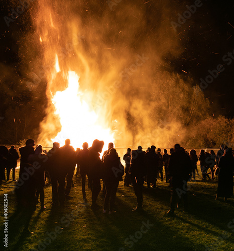 Crowd watching a bonfire during a fireworks Display At Pingle Field