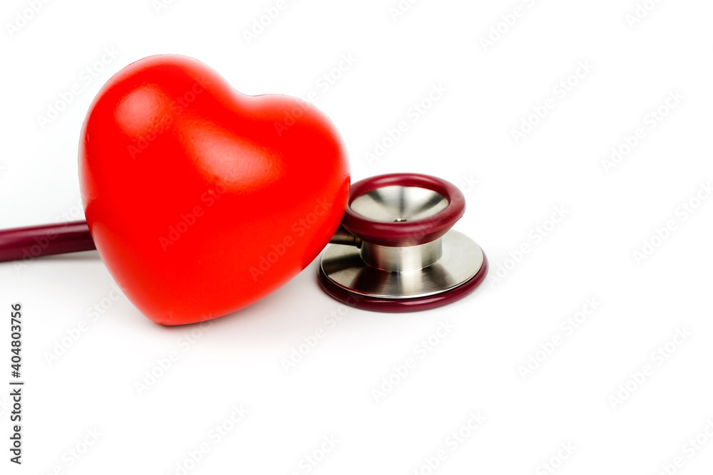 Red heart with stethoscope on white background. Selective focus.Health and Medical concept. Red heart with stethoscope on white background. Selective focus.Health and Medical concept.