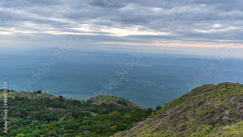 ooty village of green mountains landscape with sky and clouds . Ooty or Ootacamund or Udhagamandalam is a popular hill station in India