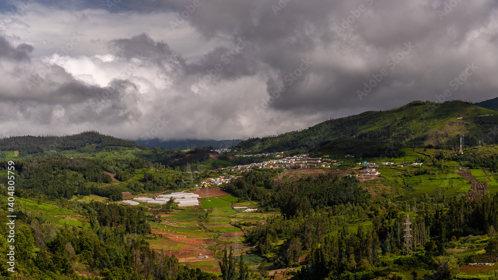 ooty village of  green mountains landscape with sky and clouds . Ooty or Ootacamund or Udhagamandalam is a popular hill station in India