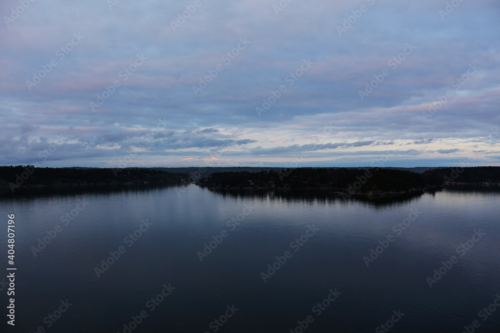Landscape with views of the sea, forest, and sky in the clouds. The nature of Sweden.