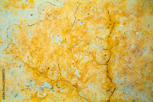 rough yellow stone background with cracks, texture