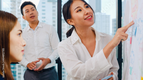 Wallpaper Mural Asia businessmen and businesswomen meeting brainstorming ideas conducting business presentation project colleagues working together plan success strategy enjoy teamwork in small modern office. Torontodigital.ca
