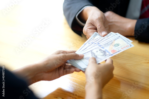Businessman or office receive cash money from another person or bribe