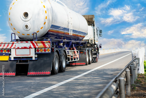 Gas Truck on highway road with tank oil container, transportation concept.,import,export logistic industrial Transporting Land transport on the asphalt expressway with blue sky