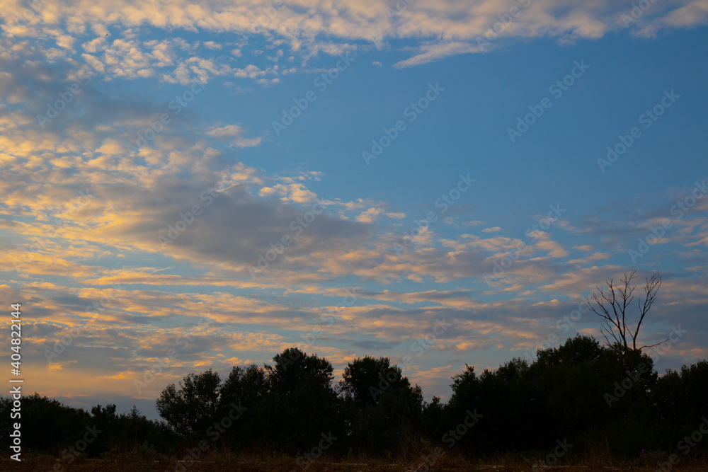 Fototapeta premium Colorful yellow clouds at blue sky