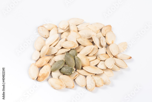 Dry pumpkin seeds isolated on white background