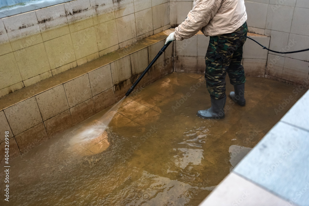 Cleaning swimming pool using high pressure power washer. Cleaning swimming pool using high pressure power washer.