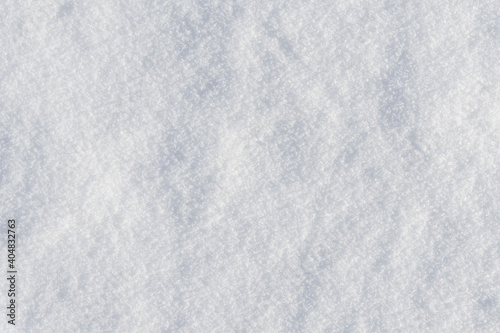 White clean shiny snow background texture. fresh snow seamless texture. snowy surface closeup
