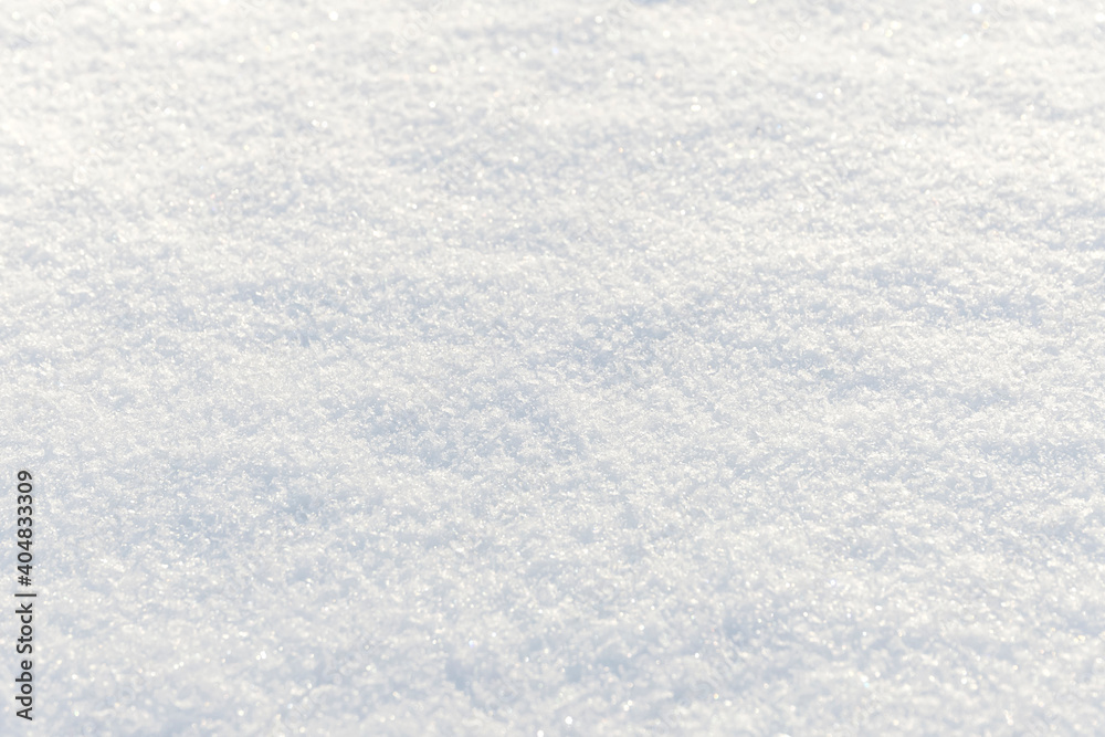 White clean shiny snow background texture. fresh snow seamless texture. snowy surface closeup White clean shiny snow background texture. fresh snow seamless texture. snowy surface closeup