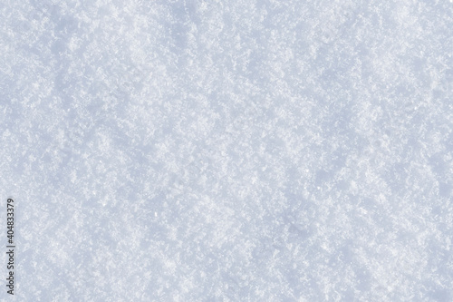 White clean shiny snow background texture. fresh snow seamless texture. snowy surface closeup