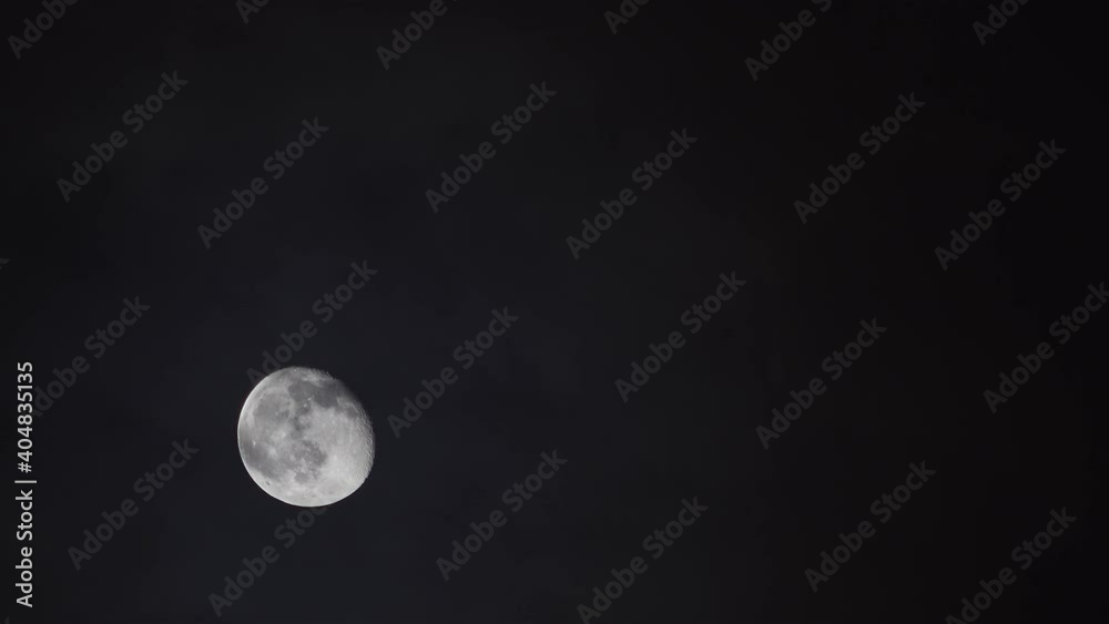 Big Moon with Cloud Movement at hot summer night when overheated air causes visible air flow in front of camera, absolutely black night Big Moon with Cloud Movement at hot summer night when overheated air causes visible air flow in front of camera, absolutely black night