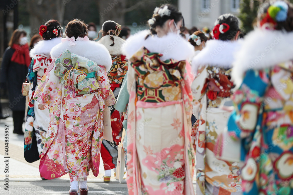 Japanese young girls wearing mask in Kimono (furisode)