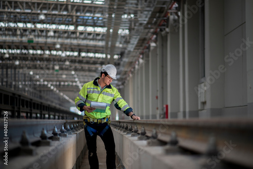 Obraz na płótnie engineer standing on railway inspection