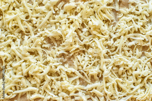 Texture of grated cheese on a lasagne