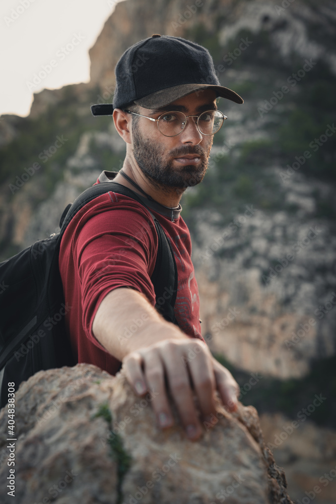 Man caught on a rock looking deep