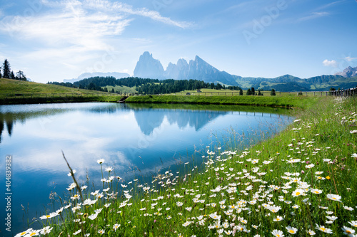 Fototapeta Naklejka Na Ścianę i Meble -  Mountain landscape in the Alps with rugged peaks reflecting in alpine lake in summer