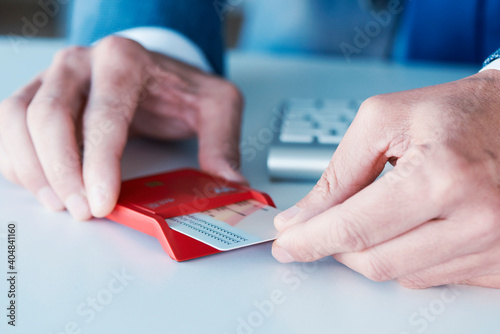 man insearting an electronic identification in a reader photo