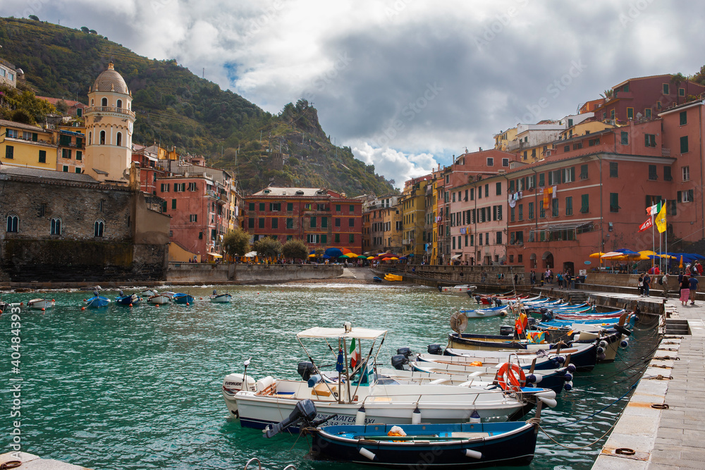 Vernazza, Cinque Terre, Liguria, Italy: the tiny bay and harbour and the busy Piazza Marconi beyond