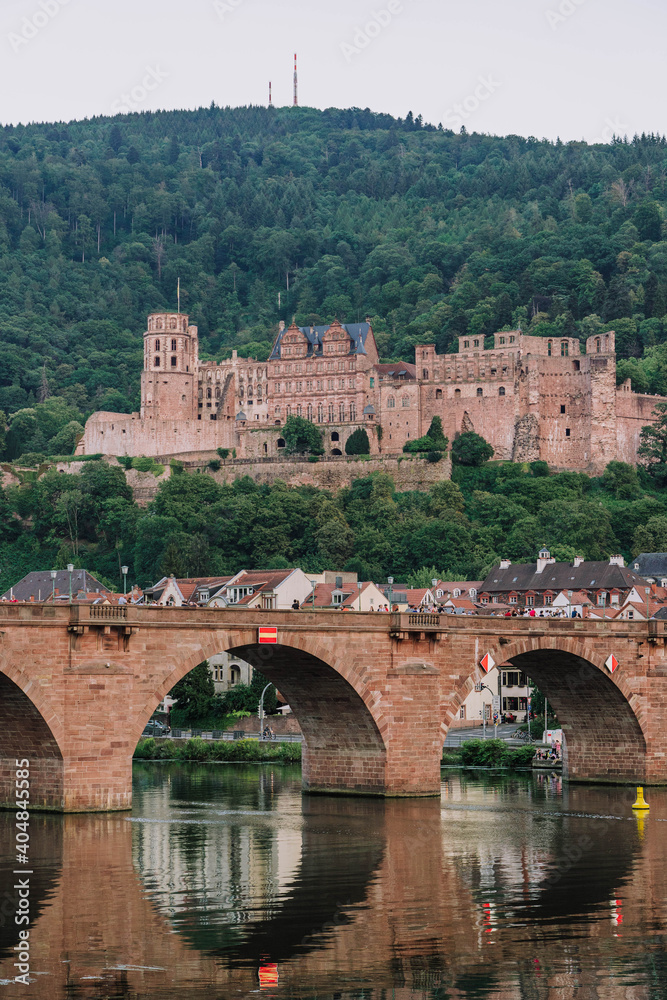 Heidelberg old bridge over Neckar river after sunset in summer Heidelberg old bridge over Neckar river after sunset in summer