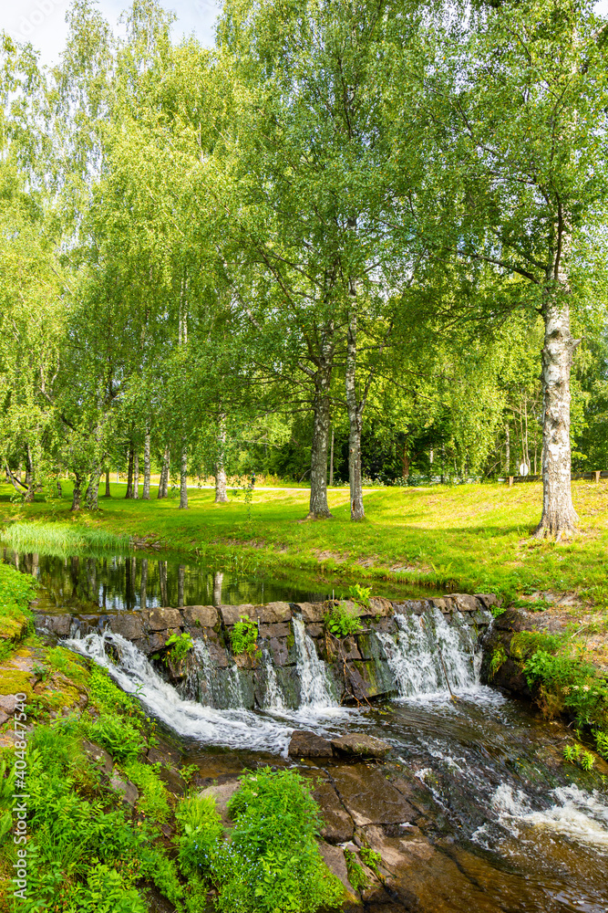 Summer view of the park with small canal, Saimaa Canal, Mustola, Lappeenranta, Finland Summer view of the park with small canal, Saimaa Canal, Mustola, Lappeenranta, Finland