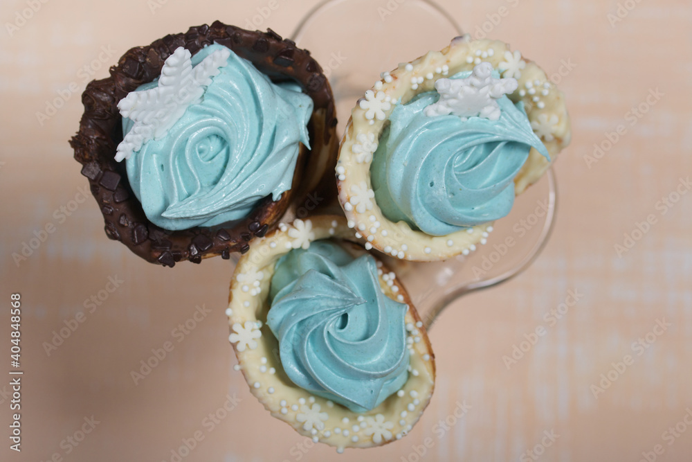 Wafer cones filled with marshmallows. With white and dark chocolate. Decorated with pastille snowflakes. Wafer cones filled with marshmallows. With white and dark chocolate. Decorated with pastille snowflakes.