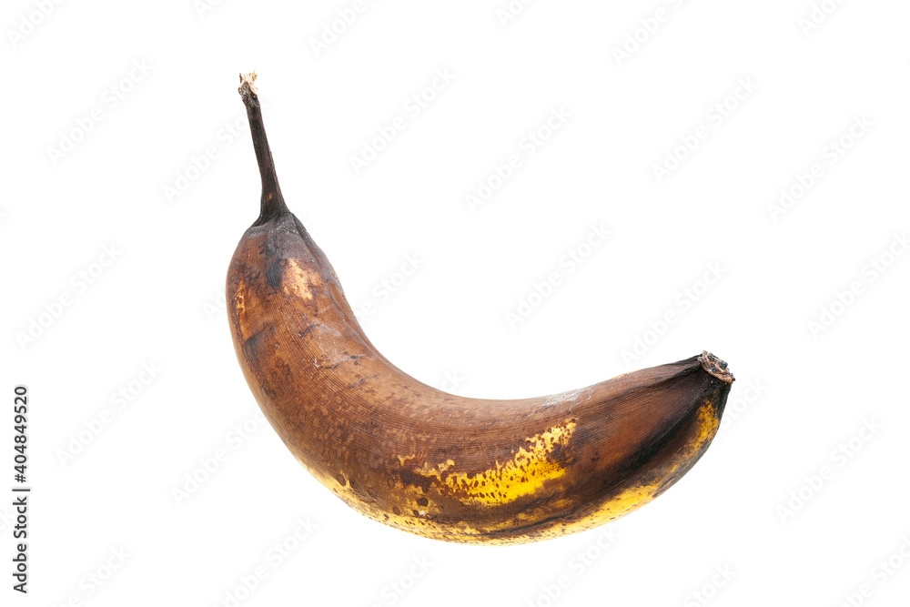overripe spotted banana in yellow rotten peel vegetarian exotic fruit isolated on white background side view. overripe spotted banana in yellow rotten peel vegetarian exotic fruit isolated on white background side view.