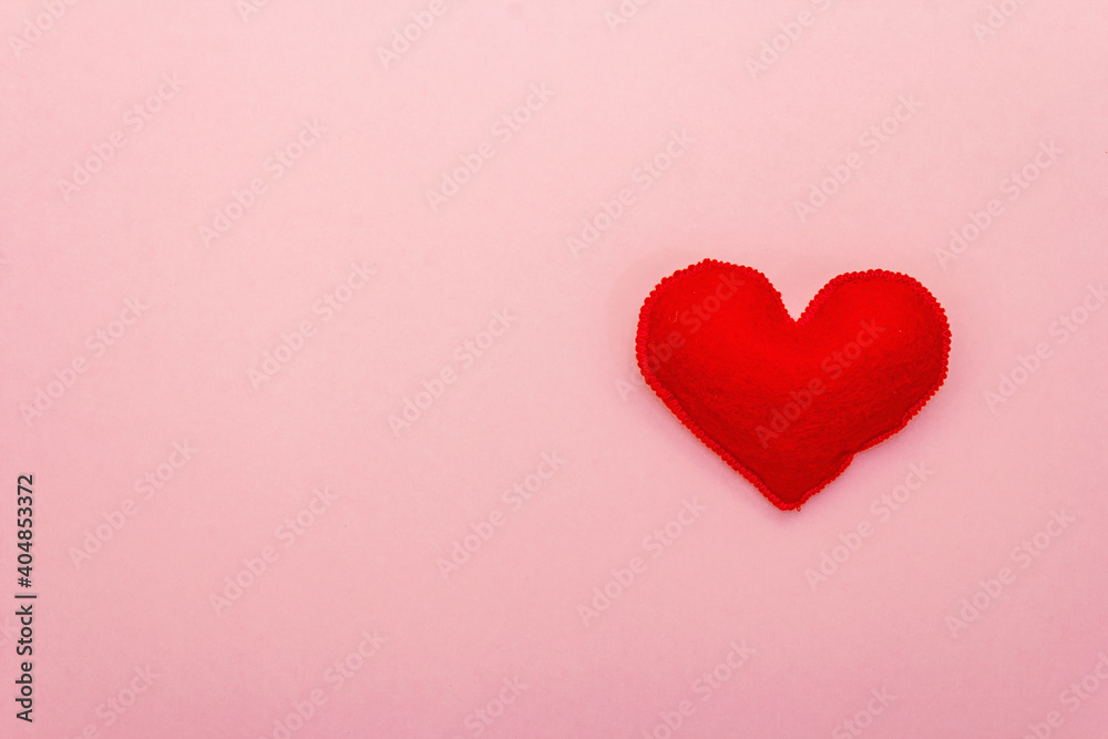 Valentine's day or Wedding romantic concept with red heart on pink background