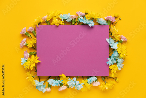 Spring blossom. Floral  frame on yellow background. For easter and spring greeting cards with copy space. Springtime. Flat lay  top view  copy space.