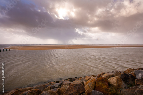 dusk on the sea and nature reserve Casse de la Belle Henriette, effects of environemental changes and global warning can be seen with ocean gaining space over the beach and land, Vendee, France photo