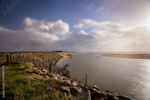 dusk on the sea and nature reserve Casse de la Belle Henriette  effects of environemental changes and global warning can be seen with ocean gaining space over the beach and land  Vendee  France