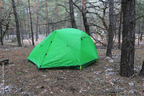 green tourist tent in forest
