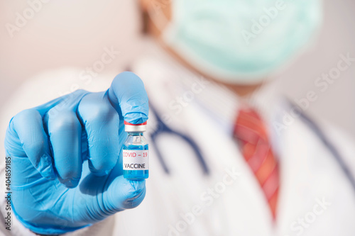 doctor holding Covid-19 vaccine in laboratory,Coronavirus or Covid-19 outbreak concept

