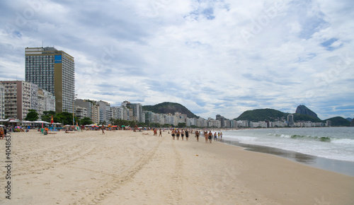 Fototapeta Naklejka Na Ścianę i Meble -    Citizens swim and sunbathe on the beach of Copacabana