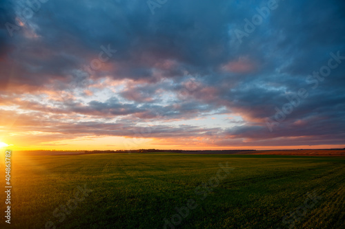 Attractive evening sky of agrarian land. Fresh vibrant colors. © Leonid Tit