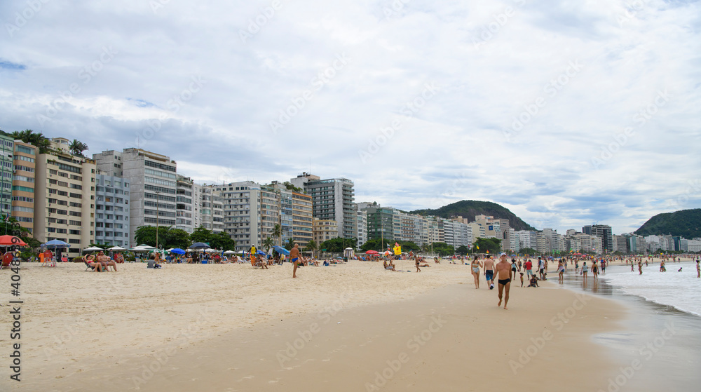   Citizens swim and sunbathe on the beach of Copacabana