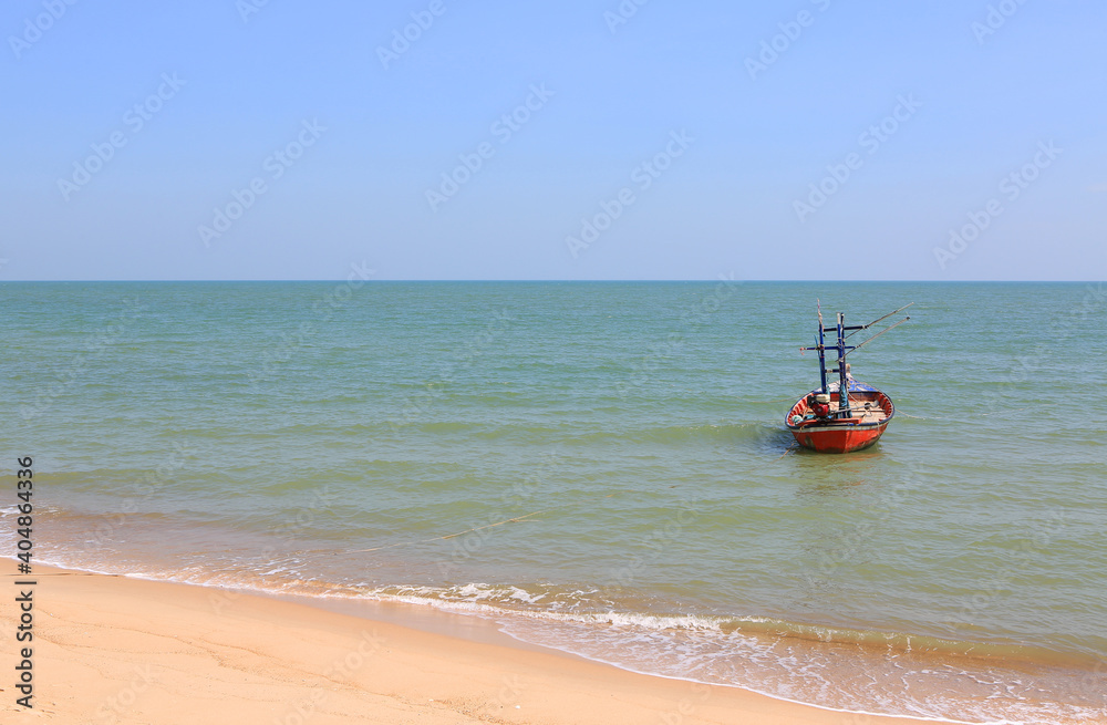 Fishing boat floating on sea side thailand beach.
