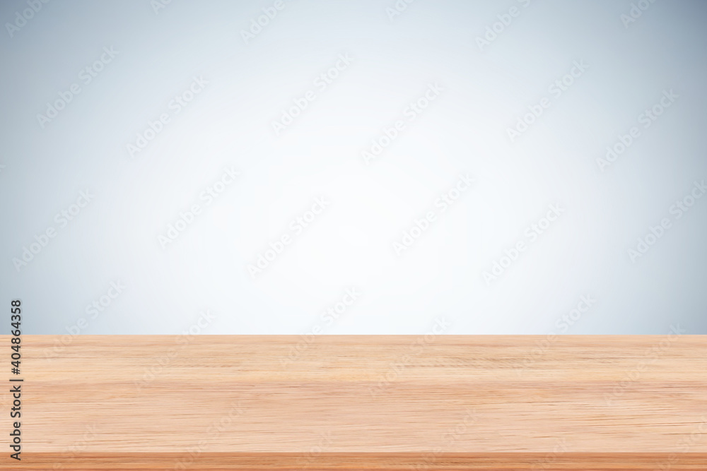 Empty brown wood table top on gray background. Used for display or montage your products. Empty brown wood table top on gray background. Used for display or montage your products.