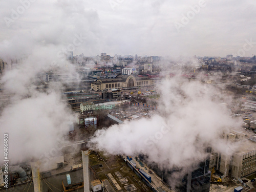 Aerial drone view. The building of the Kiev railway station through the white smoke from the chimneys.