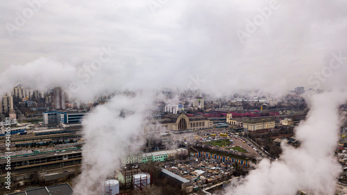 Aerial drone view. The building of the Kiev railway station through the white smoke from the chimneys.