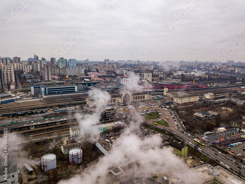 Aerial drone view. The building of the Kiev railway station through the white smoke from the chimneys. © Sergey